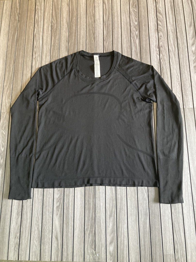 Lululemon Long Sleeve Athletic Top Size 14 (Category: Longsleeves) located in Trece Martires City. Submitted by thriftkoto.91 (Listing ID 1466564496, Image 1). Description: - Brand: Lululemon - Color: Dark Grey - Size: 14 - Material: Comfortable seamless fabric with ribbed detailing on sleeves and hem - Features: Practical thumbholes at the cuffs and a small reflective logo on the upper back - Condition: Great for workouts and everyday activewear