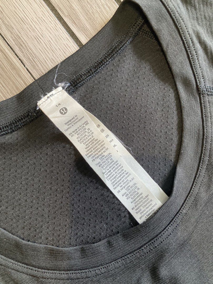 Lululemon Long Sleeve Athletic Top Size 14 (Category: Longsleeves) located in Trece Martires City. Submitted by thriftkoto.91 (Listing ID 1466564496, Image 2). Description: - Brand: Lululemon - Color: Dark Grey - Size: 14 - Material: Comfortable seamless fabric with ribbed detailing on sleeves and hem - Features: Practical thumbholes at the cuffs and a small reflective logo on the upper back - Condition: Great for workouts and everyday activewear