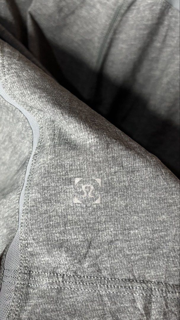 Lululemon Men's Grey Athletic Shorts (Category: Shorts) located in Mangaldan. Submitted by shortavenue (Listing ID 1466597449, Image 3). Description: Size 30-36 Length 19 Grey heathered Lululemon athletic shorts with an elastic waistband. Zippered pockets on both sides. Breathable fabric. Iconic Lululemon logo printed on the back leg. Comfortable fit for running, gym sessions, or casual wear..