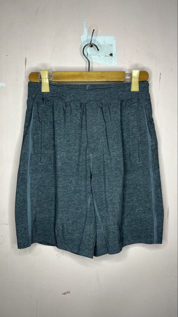 Lululemon Men's Grey Athletic Shorts (Category: Shorts) located in Mangaldan. Submitted by shortavenue (Listing ID 1466597449, Image 1). Description: Size 30-36 Length 19 Grey heathered Lululemon athletic shorts with an elastic waistband. Zippered pockets on both sides. Breathable fabric. Iconic Lululemon logo printed on the back leg. Comfortable fit for running, gym sessions, or casual wear..