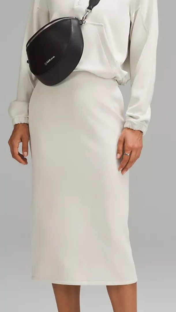 Lululemon Midi Skirt Light Grey (Category: Skirts) located in Manila. Submitted by patriciab12636 (Listing ID 1466685342, Image 1). Description: - Brand: Lululemon - Color: white tone - Style: Midi length skirt with clean lines - Features: Convenient side pockets and back slit for easy movement - Perfect for: Casual outings, running errands, or everyday wear - Condition: Excellent / Well-maintained.