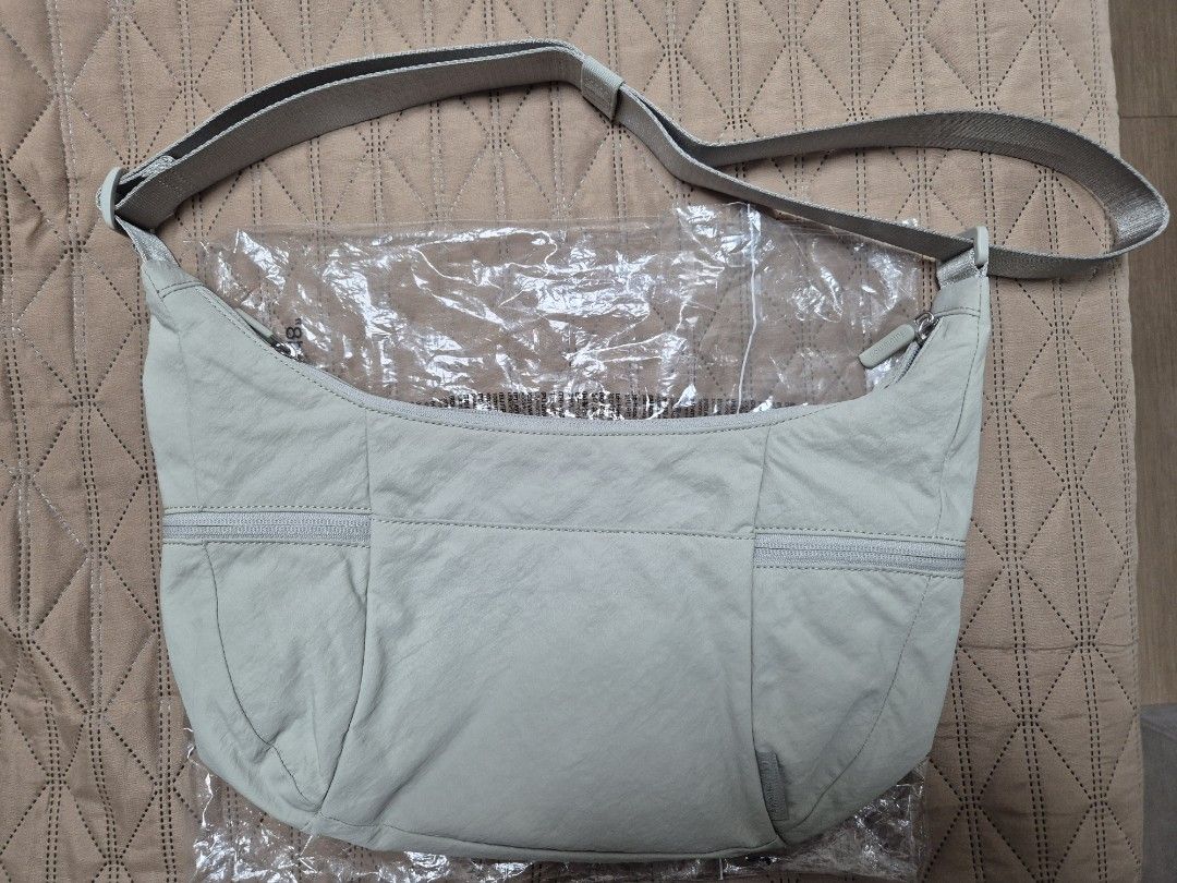 Lululemon Slouchy Sling Bag (6L) (Category: Cross-body Bags) located in Manila. Submitted by kimfl (Listing ID 1466719509, Image 2). Description: RFS: Decluttering Color: Light Ivory in Silver Hardware.