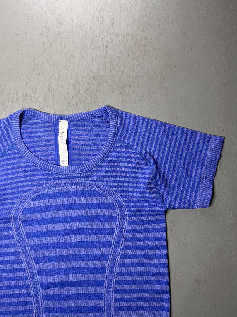 Lululemon Swiftly Tech Short Sleeve Blue Striped Size 6 (Category: Activewear) located in Catbalogan. Submitted by yellfindss (Listing ID 1466754548, Image 2). Description: - Brand: Lululemon -15/25 - Style: Short-sleeve athletic top with a round neckline - Color/Pattern: Bright blue striped - Size: 6 (inner collar tag attached) - Material: 87% nylon, 13% lycra spandex (lightweight and seamless) - Condition: Clean, excellent, and ready to wear - 