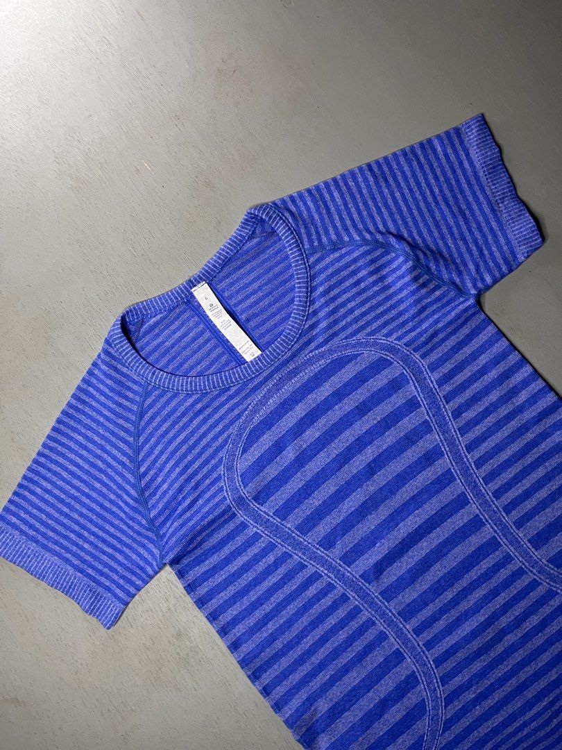 Lululemon Swiftly Tech Short Sleeve Blue Striped Size 6 (Category: Activewear) located in Catbalogan. Submitted by yellfindss (Listing ID 1466754548, Image 3). Description: - Brand: Lululemon -15/25 - Style: Short-sleeve athletic top with a round neckline - Color/Pattern: Bright blue striped - Size: 6 (inner collar tag attached) - Material: 87% nylon, 13% lycra spandex (lightweight and seamless) - Condition: Clean, excellent, and ready to wear - 