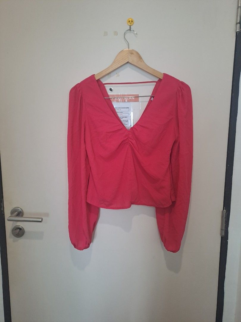 Lulu's blouse (Category: Longsleeves) located in Manila. Submitted by joanbalde39643 (Listing ID 1466664211, Image 1). Description: This elegant LULU hot pink long-sleeve blouse features a deep V-neckline with delicate ruching down the front and voluminous balloon sleeves. It can be paired effortlessly with high-waisted jeans for a casual look or dressed up with tailored trousers for an evening out..