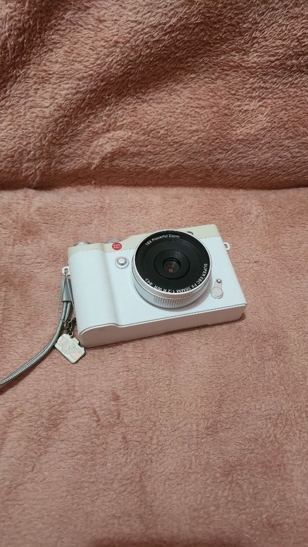 LUXARA Digital Camera (Category: Cameras) located in Bulacan. Submitted by rynnhoon (Listing ID 1466567596, Image 1). Description: - Model: LUXARA Compact Digital Camera (White) - Lens: Fixed 18.5mm wide-angle lens - Condition: Clean body with minimal signs of handling - Extras: Includes grey strap with small camera charm - Functionality: Battery and memory card slots fully functional, ready to shoot straight away - Use Case: Great everyday pocke