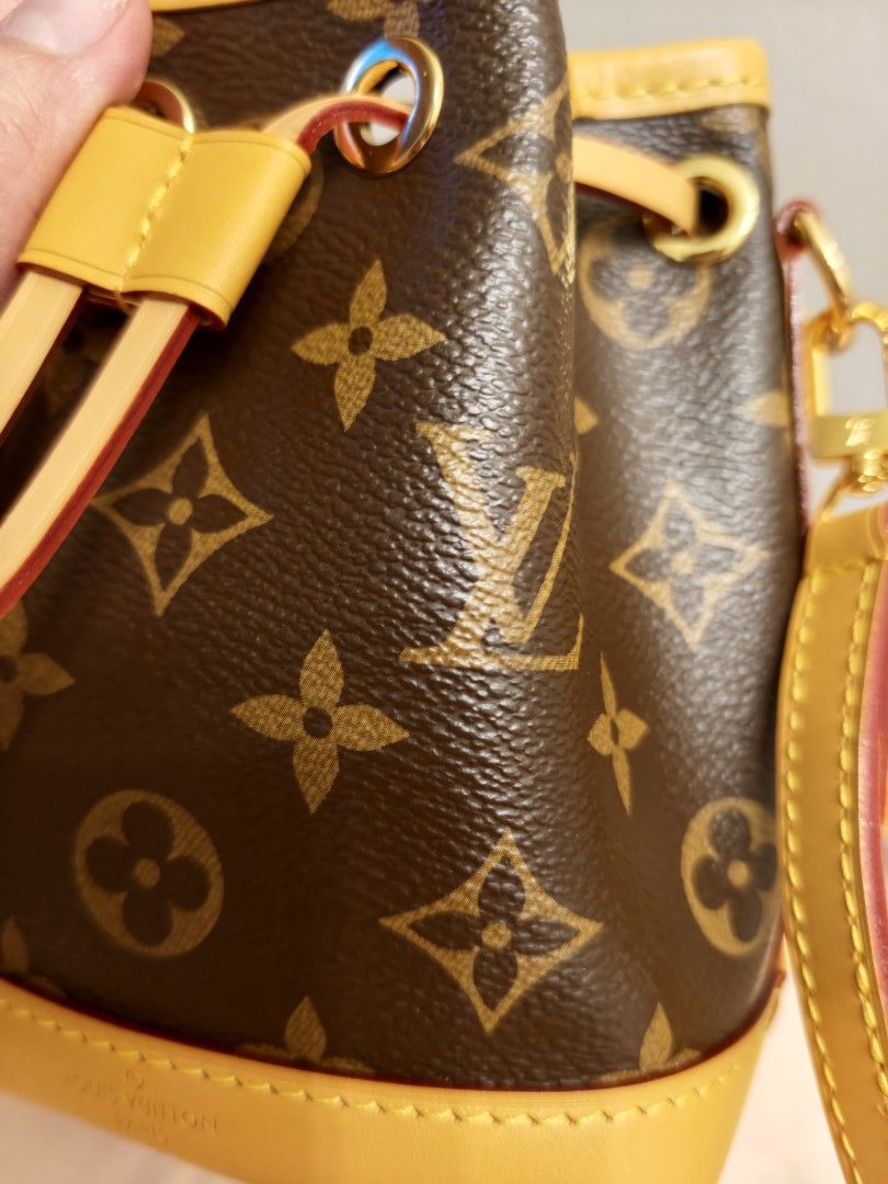 LV Nano Noe Monogram Canvas Bucket Bag (Category: Luxury Bags & Wallets) located in Antipolo. Submitted by jarazote (Listing ID 1466659632, Image 2). Description: Louis Vuitton Monogram canvas bucket bag with yellow leather trim. Drawstring closure on top. Includes detachable yellow leather strap and dust bag. Interior lined in dark fabric. Monogram pattern all over.No auth card .