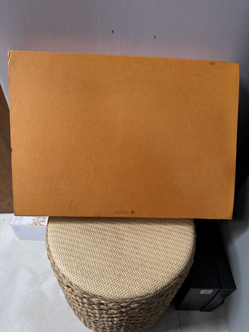 LV Shawl Box (Category: Luxury Accessories) located in Paranaque City. Submitted by joyjoygeneral.merchandise (Listing ID 1466599612, Image 3). Description: Original Louis Vuitton Shawl Box Original Louis Vuitton packaging box for a shawl/scarf. Classic orange-brown textured finish with Louis Vuitton branding on the lid. The box is pre-loved and has some visible signs of handling/storage, but remains presentable and suitable for keeping or packag