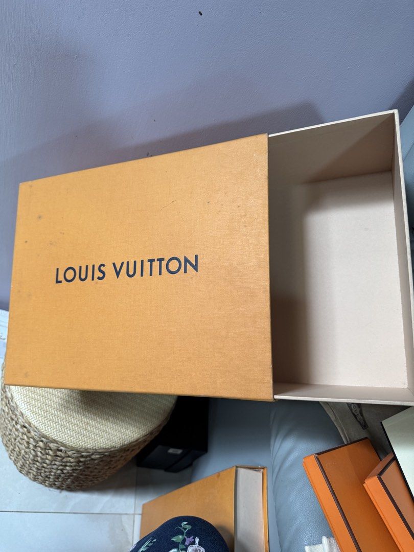 LV Shoe Box (Category: Luxury Accessories) located in Paranaque City. Submitted by joyjoygeneral.merchandise (Listing ID 1466602231, Image 1). Description: Louis Vuitton Original Shoe Box – Pre-Loved Original Louis Vuitton shoe box in the classic orange/tan finish with the LV logo. Features the original white interior and drawer-style design. Pre-loved with some minor signs of storage and handling, as shown in the photos. Condition: Good pre-love