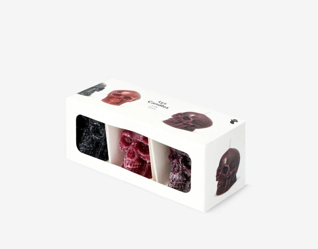 Lys Skull Candles 3 pcs Set (Category: Home Fragrance) located in Davao. Submitted by jmhocson (Listing ID 1466637173, Image 1). Description: - Brand: Lys - Set of 3 skull-shaped candles - Colors: Black, red, and purple - Condition: Brand new, unused in original box - Packaging: White gift box with window cutouts - Ideal for: Gothic decor, Halloween, and spooky room styling.