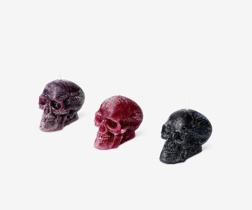 Lys Skull Candles 3 pcs Set (Category: Home Fragrance) located in Davao. Submitted by jmhocson (Listing ID 1466637173, Image 3). Description: - Brand: Lys - Set of 3 skull-shaped candles - Colors: Black, red, and purple - Condition: Brand new, unused in original box - Packaging: White gift box with window cutouts - Ideal for: Gothic decor, Halloween, and spooky room styling.