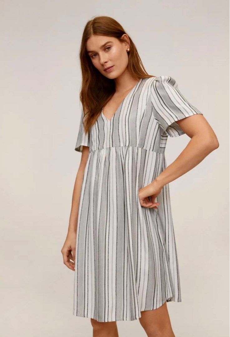 Mango Striped Short Dress (Category: Dresses) located in Quezon City. Submitted by onyx72 (Listing ID 1466624146, Image 1). Description: Authentic Mango Striped Short Dress Casual babydoll-style dress Relaxed, high-waist smock fit with a gathered empire seam and flared floaty hemline Flattering V-neckline and short, subtly fluttered sleeves Veryical multi-toned neutral stripes in white, charcoal and soft grey Best fits xtra small to small😊 Used 