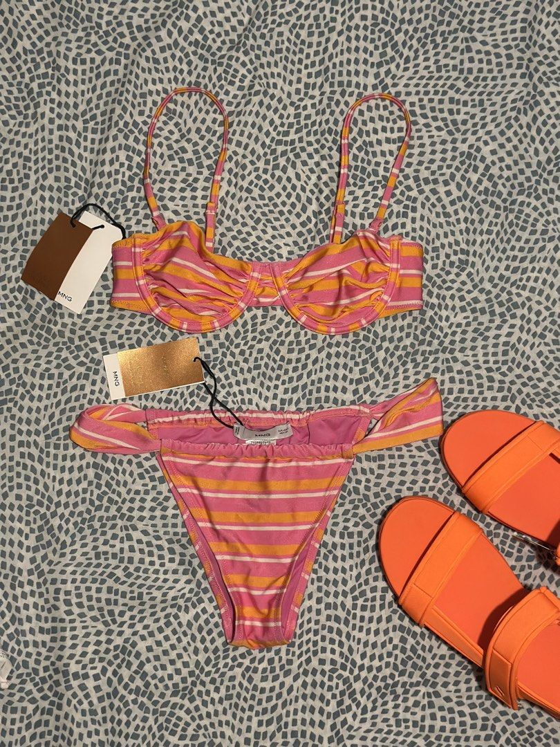 Mango swimsuits (Category: Bikinis & Swimsuits) located in Taguig. Submitted by tinacas018 (Listing ID 1466601790, Image 1). Description: - Brand: Mango - Style: Bright pink and orange striped bikini - Condition: Brand new with tags (never worn) - Top: Underwire with adjustable straps - Bottoms: Matching with side ruching - Perfect for: Beach trips and pool days.