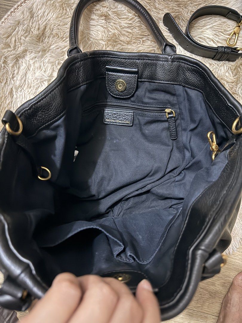 Marc by Marc Jacobs Black Leather Workwear Handbag (Category: Luxury Bags & Wallets) located in Quezon City. Submitted by rosell.xoxo (Listing ID 1466687042, Image 3). Description: Black textured leather handbag by Marc by Marc Jacobs, Standard Supply line, Workwear model. Gold hardware plaque on the front. Double top handles plus an adjustable, detachable shoulder strap. Magnetic snap closure. - Lighly used.