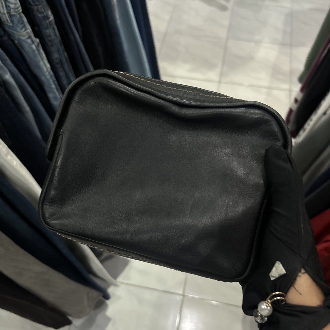 Marc Jacob sling Bag with Gold Hardware (Category: Cross-body Bags) located in Bambang. Submitted by heats777 (Listing ID 1466662933, Image 2). Description: - Style: Black leather crossbody bag with a structured rectangular shape - Details: Chic contrast white stitching along edges and seams - Hardware: Premium gold-toned metal logo plaque and chunky gold zipper closure - Size: Compact and lightweight, ideal for everyday carry - Condition: Lightl