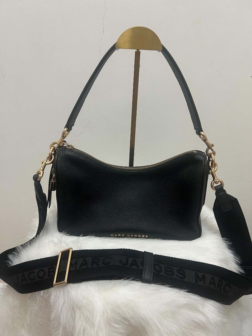 Marc Jacobs Drifter Two Way Bag (Category: Shoulder Bags) located in Paoay. Submitted by rvf1230 (Listing ID 1466578905, Image 2). Description: - Authentic Marc Jacobs shoulder bag in black pebbled leather - Elegant gold-tone hardware with a stylish side padlock accent - Secure zip top closure with iconic front logo lettering - Pristine, clean condition both inside and out - Includes two interchangeable straps: a matching leather strap and an adj