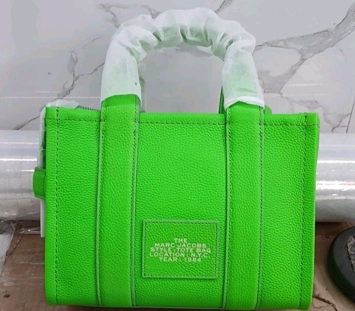 Marc Jacobs Leather Tote Bag (Category: Tote Bags) located in Pasig City. Submitted by jkeeei (Listing ID 1466663966, Image 2). Description: - Brand: Marc Jacobs - Style: Leather Tote Bag - Color: harbor blue and Apple Green - Condition: Used Once - Rationale for selling: Decluttering closet 2 bags for 7,499 only.