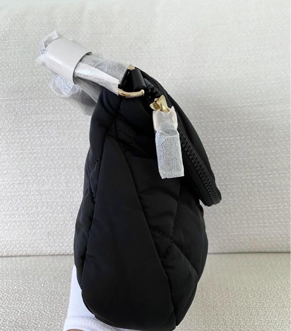 Marc Jacobs Quilted Nylon Crossbody Bag Black (Category: Cross-body Bags) located in Abulug. Submitted by jamiecammie (Listing ID 1466700809, Image 2). Description: Marc Jacobs quilted nylon crossbody bag in classic black. Front flap closure with gold-tone hardware and signature logo plaque. Zippered main compartment, interior zip pocket. Adjustable strap wrapped in protective packaging, original store tags attached. Never used, pristine conditio