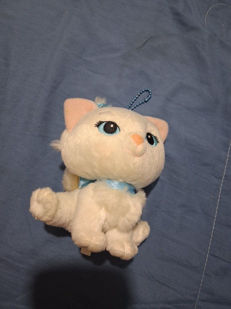 Marie Aristocats Plush Keychain Toy (Category: Plushies & Soft Toys) located in Caloocan City. Submitted by ms.regina (Listing ID 1466649093, Image 1). Description: - Marie-inspired white kitten plush toy - Fluffy white fur with pink inner ears and embroidered blue eyes - Adorned with a bright blue neck ribbon and matching head bow - Includes a blue ball chain for hanging on bags, keys, or pouches - Compact and lightweight size, perfect for daily