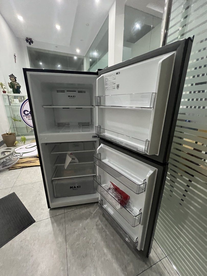 Maxi double door refrigerator with energy label (Category: Refrigerators and Freezers) located in Pasay City. Submitted by katkat143 (Listing ID 1466744380, Image 1). Description: - Brand/Model: Maxi Double Door Refrigerator - Color: Black exterior with clean white interior - Energy Efficiency: Energy label rating 260 - Fridge Features: Adjustable glass shelves, door bins, and bottom crisper drawer - Freezer Features: Built-in shelf and convenien