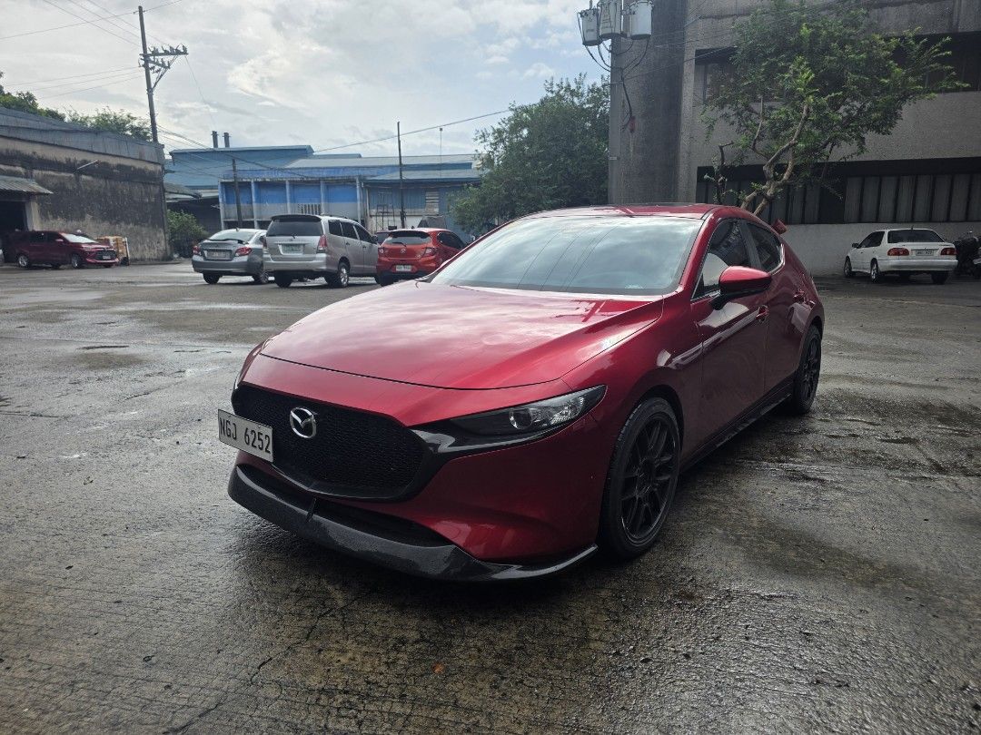 Mazda 3 1.5 Hatchback Deluxe 6AT (A) (Category: Used Cars) located in Manila. Submitted by safecat-4a76 (Listing ID 1466726628, Image 3). Description: FOR SALE: 2020 Mazda 3 Elite A well-kept Mazda 3 Elite in Soul Red, with a clean and tasteful setup. Ideal for someone looking for a stylish, premium daily car without the need for additional upgrades. Variant: Mazda 3 Elite Year Model: 2020 Mileage: 45,000 km Color: Soul Red Wheels: Enkei Mags Ext