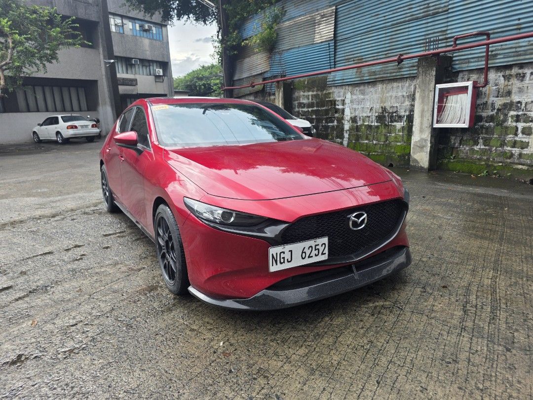 Mazda 3 1.5 Hatchback Deluxe 6AT (A) (Category: Used Cars) located in Manila. Submitted by safecat-4a76 (Listing ID 1466726628, Image 2). Description: FOR SALE: 2020 Mazda 3 Elite A well-kept Mazda 3 Elite in Soul Red, with a clean and tasteful setup. Ideal for someone looking for a stylish, premium daily car without the need for additional upgrades. Variant: Mazda 3 Elite Year Model: 2020 Mileage: 45,000 km Color: Soul Red Wheels: Enkei Mags Ext