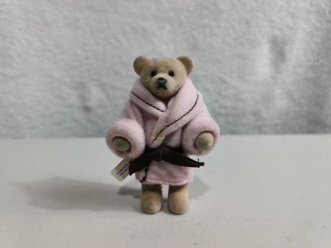 Mcdo Bathing Girl Beth Teddy Bear Keychain (Category: Plushies & Soft Toys) located in San Leonardo. Submitted by burgossanleonardo.12345 (Listing ID 1466691762, Image 2). Description: - Adorable fuzzy flocked bear figurine wearing a tiny pink bathrobe and brown belt - Includes a gold-tone chain on the back, perfect for hanging on bags, pouches, or keys - Features the authentic 'Bathing Girl Beth' white tag with a yellow bear logo - Clean and wel
