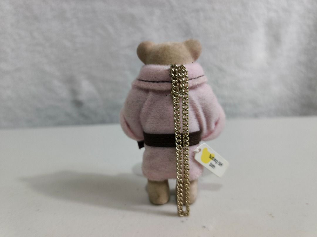 Mcdo Bathing Girl Beth Teddy Bear Keychain (Category: Plushies & Soft Toys) located in San Leonardo. Submitted by burgossanleonardo.12345 (Listing ID 1466691762, Image 3). Description: - Adorable fuzzy flocked bear figurine wearing a tiny pink bathrobe and brown belt - Includes a gold-tone chain on the back, perfect for hanging on bags, pouches, or keys - Features the authentic 'Bathing Girl Beth' white tag with a yellow bear logo - Clean and wel