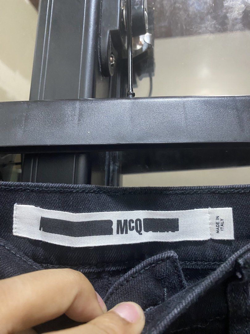 McQ Alexander McQueen Black Jeans Size 32 (Category: Jeans) located in Manila. Submitted by hell_market (Listing ID 1466683572, Image 3). Description: - Brand: McQ - Size: 32 - Origin: Made in Italy - Color/Wash: Versatile dark wash black denim - Fit: Classic straight/slim fit - Details: Branded button, large leather brand patch on the back - Condition: High quality, clean design, ready to wear.