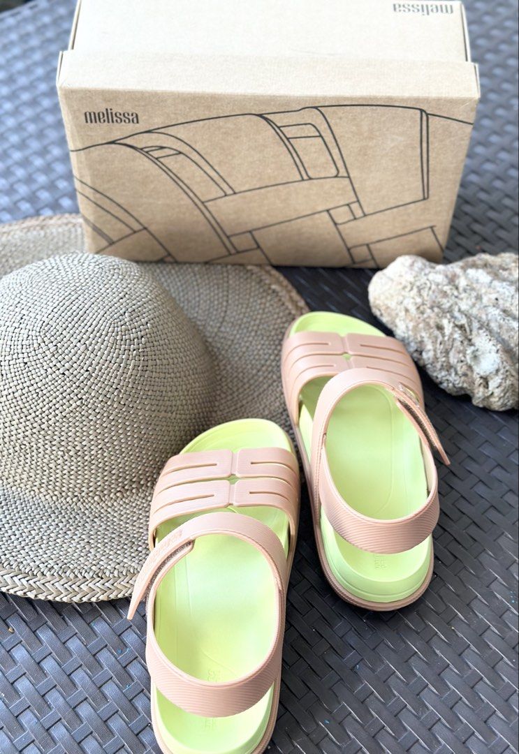 Melissa Sandals with Original Box (Category: Flats & Sandals) located in San Pablo. Submitted by angiemac0921 (Listing ID 1466610476, Image 1). Description: Available size 37 and 38 - Authentic Melissa sandals with pastel peach straps and bright lime green footbed - Chunky sole with embossed logo underneath for extra grip and style - Adjustable ankle strap with secure hook-and-loop closure - Includes original branded shoebox - Super comfortable, 
