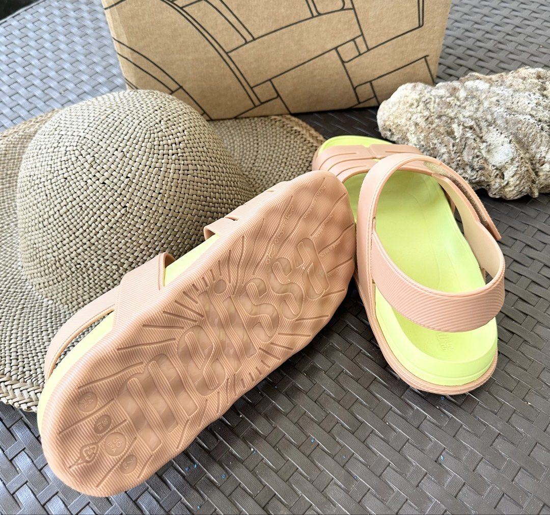 Melissa Sandals with Original Box (Category: Flats & Sandals) located in San Pablo. Submitted by angiemac0921 (Listing ID 1466610476, Image 2). Description: Available size 37 and 38 - Authentic Melissa sandals with pastel peach straps and bright lime green footbed - Chunky sole with embossed logo underneath for extra grip and style - Adjustable ankle strap with secure hook-and-loop closure - Includes original branded shoebox - Super comfortable, 