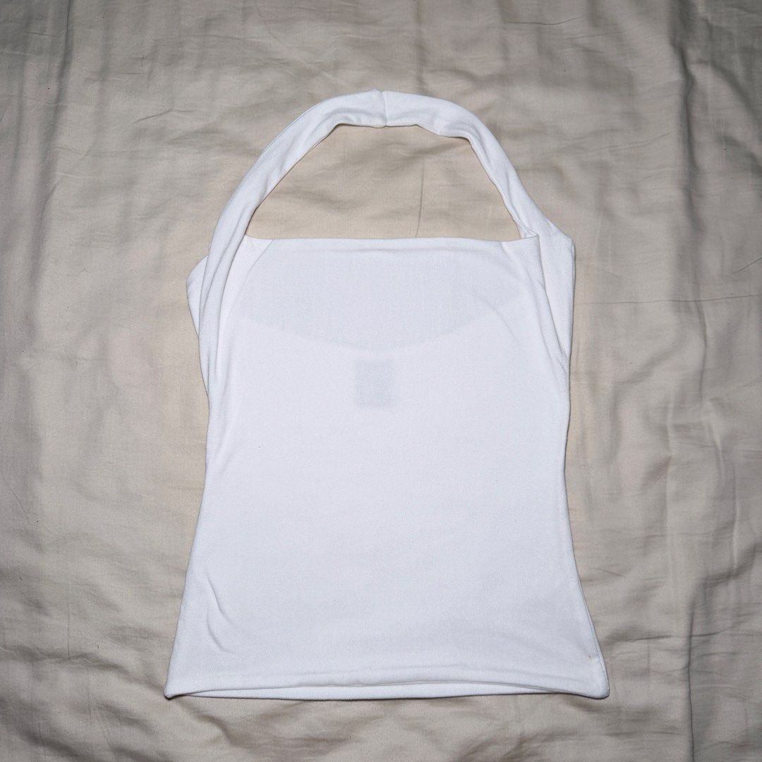 Mera White Halter Top (S) (Category: Sleeveless) located in Guinobatan. Submitted by ktonkatsu (Listing ID 1466571294, Image 1). Description: 📍BICOL Shipping via J&T - Brand: Mera - Size: S (tag attached) - Color: Clean white - Style: Halter top, sleeveless, looped neck strap, straight cut - Origin: Made in the Philippines - Condition: Brand new with tag - Perfect, versatile staple piece for warm weather.