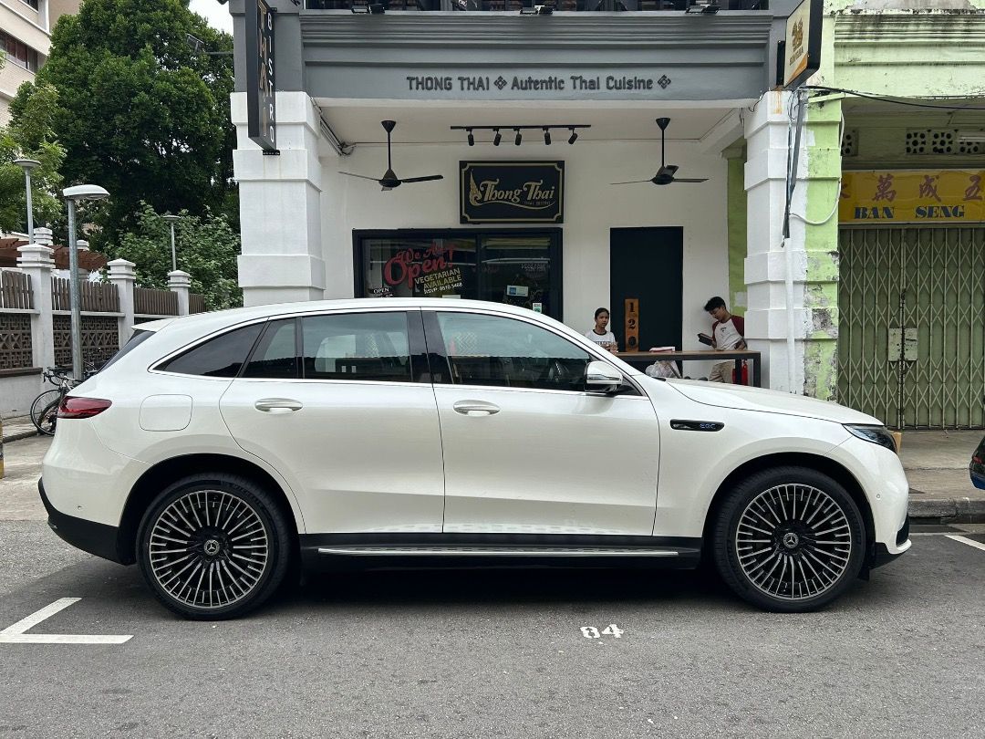 Mercedes-Benz EQC Electric EQC400 AMG Line 4MATIC Premium Plus 80 kWh (A) (Category: Used Cars) located in Singapore. Submitted by zealmountain.cf7c5a (Listing ID 1466646600, Image 1). Description: White Mercedes-Benz SUV, right-hand drive. Black leather seats with white contrast stitching and sport pedals. Digital dashboard display showing 60,579 kilometers. Multi-function steering wheel wrapped in perforated leather. Multi-spoke alloy wheels. C