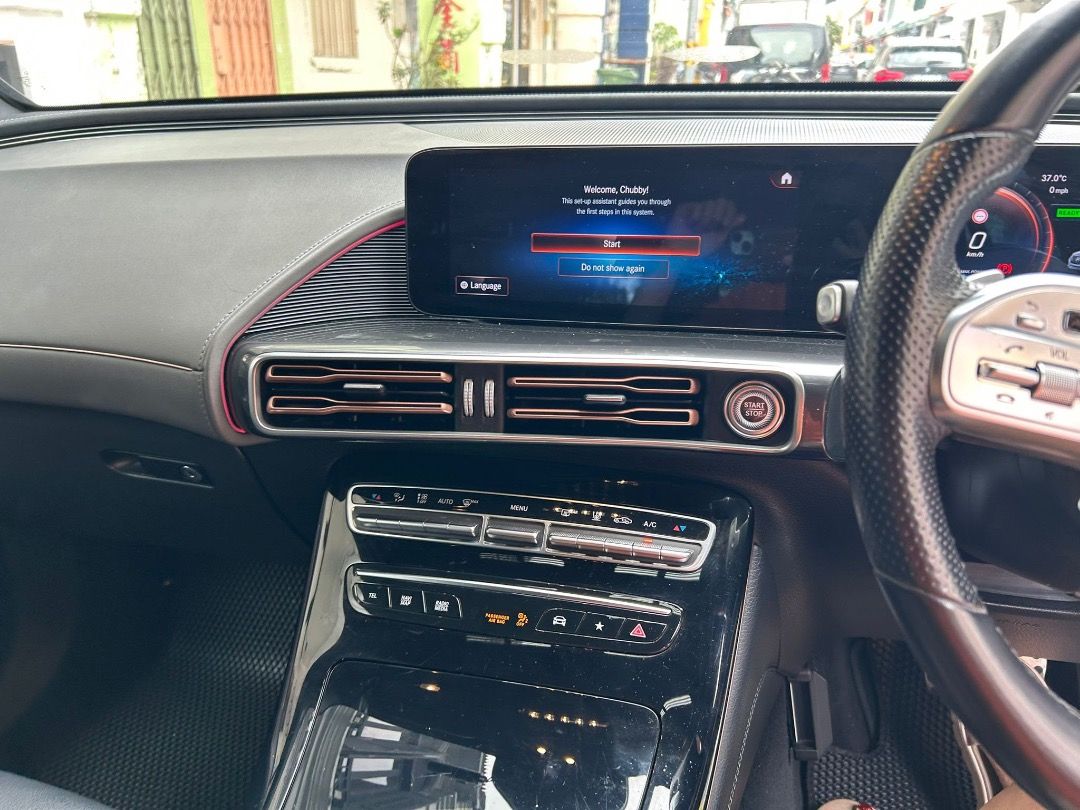 Mercedes-Benz EQC Electric EQC400 AMG Line 4MATIC Premium Plus 80 kWh (A) (Category: Used Cars) located in Singapore. Submitted by zealmountain.cf7c5a (Listing ID 1466646600, Image 3). Description: White Mercedes-Benz SUV, right-hand drive. Black leather seats with white contrast stitching and sport pedals. Digital dashboard display showing 60,579 kilometers. Multi-function steering wheel wrapped in perforated leather. Multi-spoke alloy wheels. C