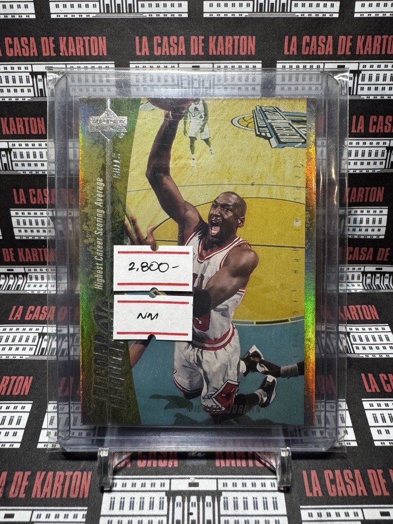 Michael Jordan (Category: Raw Singles) located in Pateros City. Submitted by lacasadekartonph (Listing ID 1466694381, Image 1). Description: - Player: Michael Jordan - Set/Insert: Upper Deck Record Breakers - Feature: Highlights his highest career scoring average - Finish: Eye-catching holographic foil - Condition/Protection: Stored securely in a rigid top loader - Ideal for: Basketball card collectors and Jordan fans.
