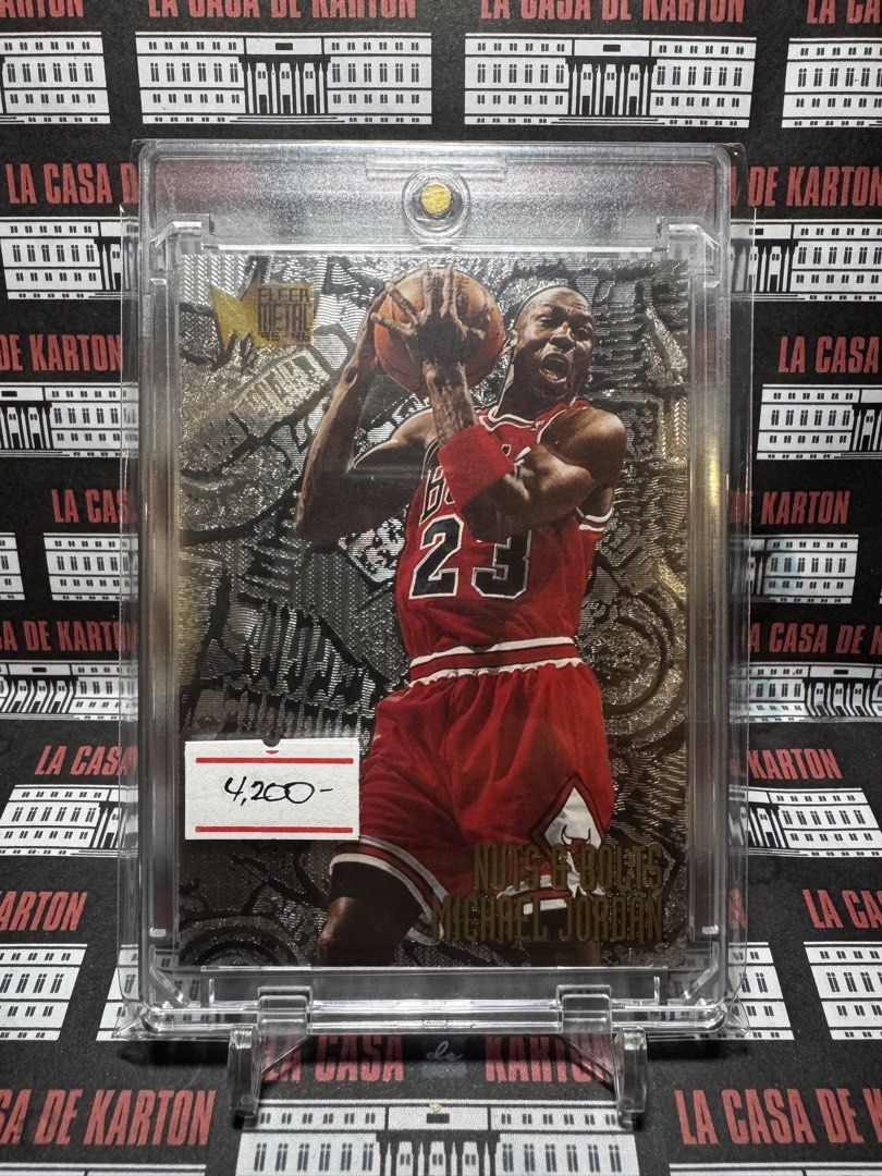 Michael Jordan (Category: Raw Singles) located in Pateros City. Submitted by lacasadekartonph (Listing ID 1466695258, Image 1). Description: - Player: Michael Jordan - Set: 1995-96 Fleer Metal - Insert: Nuts & Bolts - Condition: Excellent, protected in a clear magnetic card holder - Inclusions: Comes with a display stand - Highlights: Iconic Chicago Bulls action shot with a striking embossed metallic background - Perfect for: Basketball card coll