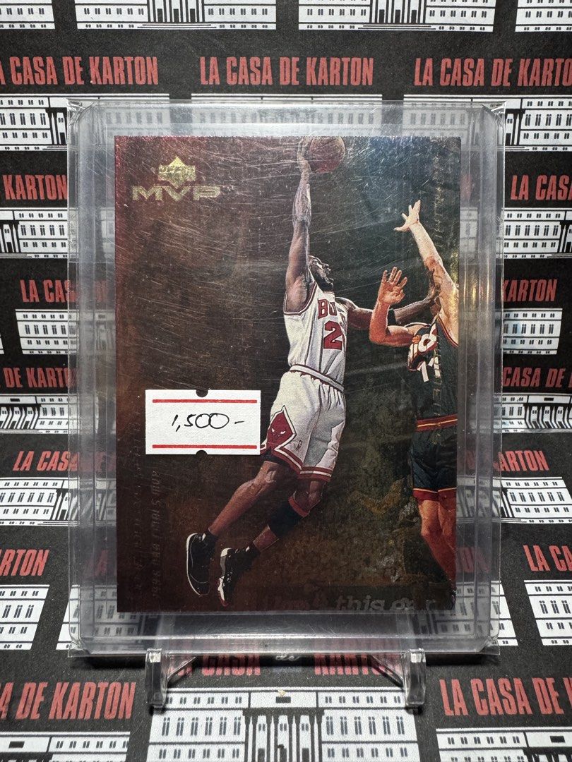 Michael Jordan (Category: Raw Singles) located in Pateros City. Submitted by lacasadekartonph (Listing ID 1466658431, Image 1). Description: - Item: Michael Jordan Upper Deck MVP Basketball Card - Highlight: Iconic 1998 NBA Finals shot against Utah - Design: Metallic gold background with crisp borders - Protection: Comes in a secure top loader - Condition: Kept protected and ready for display - Ideal For: Chicago Bulls and MJ collectors.