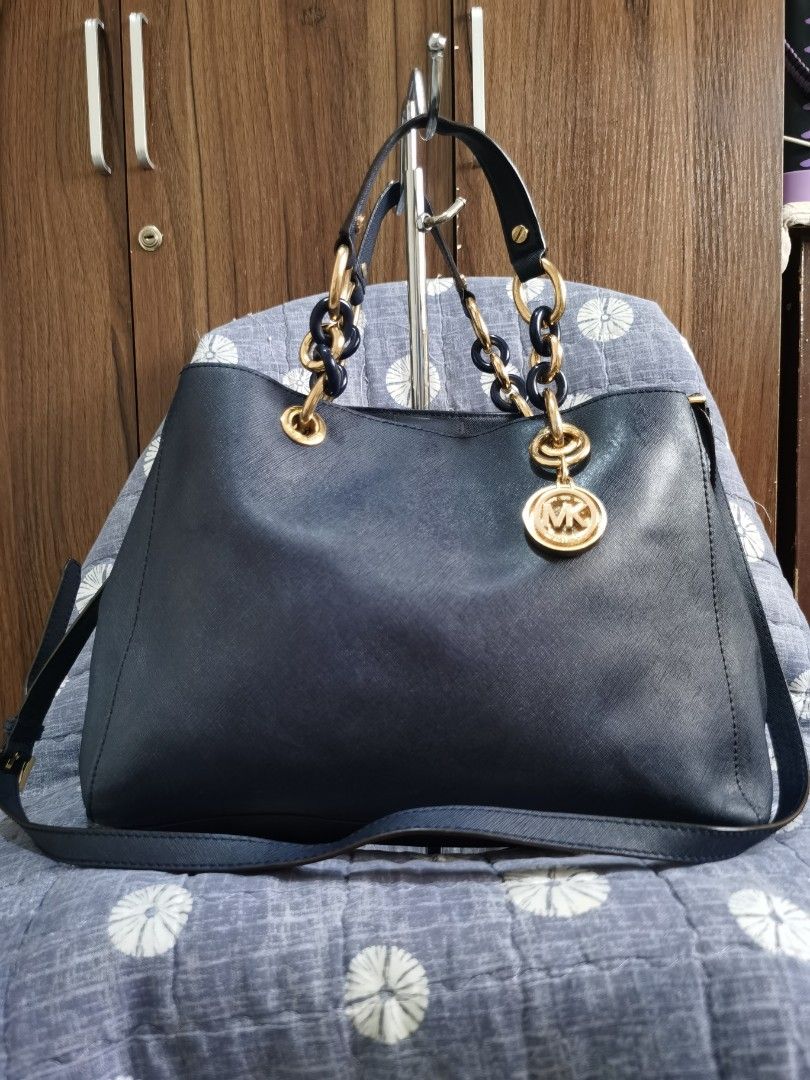MICHAEL KORS (Category: Cross-body Bags) located in Bacolod City. Submitted by mzb06 (Listing ID 1466589186, Image 1). Description: 2 way Saffiano leather material crossbody bag, midnight blue in color, gold hardwares, excellent usable condition.. 3 clean inner compartment. Dimension :H 10" / W 13"..detailed pictures posted for reference..