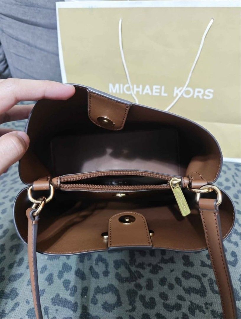 Michael Kors Brown MK Monogram Bucket Bag (Category: Luxury Bags & Wallets) located in Quezon City. Submitted by joshuaeeee02 (Listing ID 1466569714, Image 2). Description: Michael Kors Original Bag Like New Condition 1-2 times lang nagamit pang office 👜 100% Original Michael Kors 🇨🇦 Galing Canada ✅ No issue ✅ No damage ✅ No scratches / gasgas ✅ Maingat gamitin at well-maintained ✅ Malinis loob at labas ✅ Ready to use Kasama ang original paper