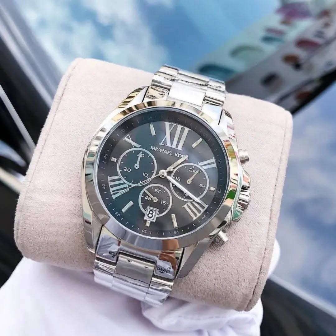 Michael Kors Chronograph Watch Set (Category: Women's Watches) located in Lapu-Lapu City. Submitted by cheche2020 (Listing ID 1466607165, Image 2). Description: Japan movement - Brand new Michael Kors matching his-and-hers chronograph wristwatch set - Stunning silver and gold two-tone stainless steel bands with protective plastic still attached - Elegant dial featuring chronograph subdials, date window, and Roman numerals at 12, 4, and 8 o'clock 