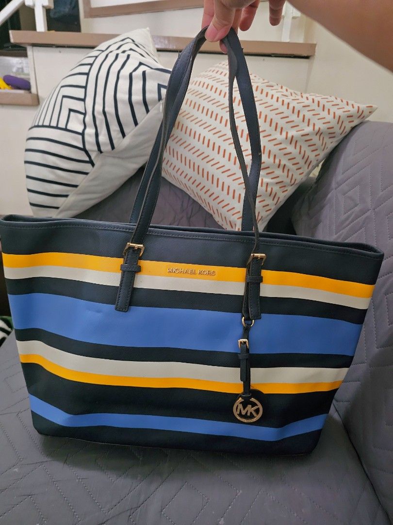 Michael Kors Jet set Stripe Tote (Category: Tote Bags) located in Manila. Submitted by shopaholicmimi (Listing ID 1466637320, Image 1). Description: 📍authentic striped yello. blue white large tote 📍preloved and in good condition (please see photos) minor issue on rubber lining not ergo, legacy, vintage, soho, saddle, demi, zoe, carly, eastwest, patchwork, rare, canvas, signature, laurel, hobo, kili, coach.