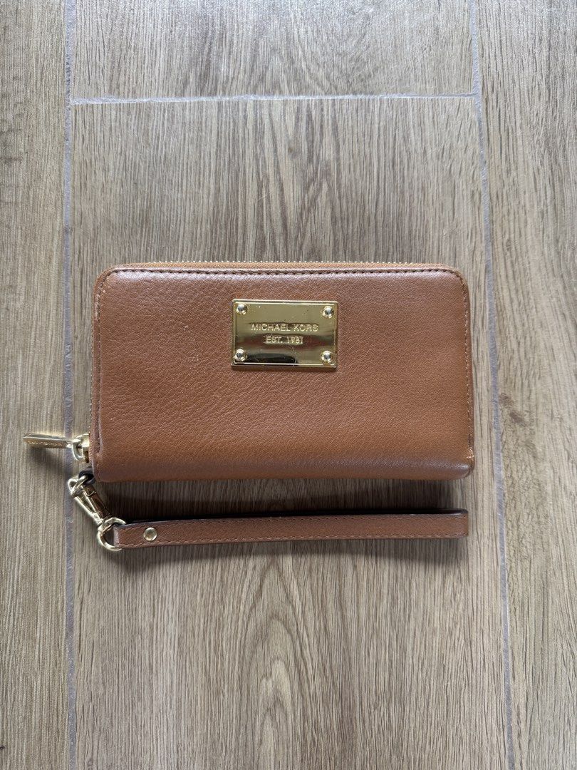 Michael Kors Phone Wallet (Category: Wallets & Card holders) located in Santa Rosa. Submitted by meldeclutters (Listing ID 1466563732, Image 1). Description: Michael Kors Phone Wallet Bought in Japan Lightly used, signs of usage Php 800 RFS: Declutter.