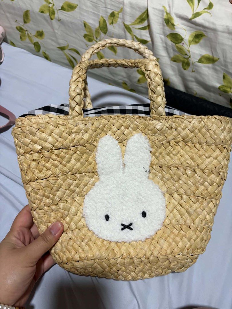 Miffy Bunny Woven Straw Handbag with Gingham Lining (Category: Shoulder Bags) located in Pasig City. Submitted by johndarell47046 (Listing ID 1466721854, Image 1). Description: - Adorable Miffy bunny patch with embroidered details on the front - Stylish woven straw design with sturdy double braided top handles - Cute black and white gingham checkered fabric lining - Secure drawstring closure to keep your items safe - Ideal accessory for summer ou