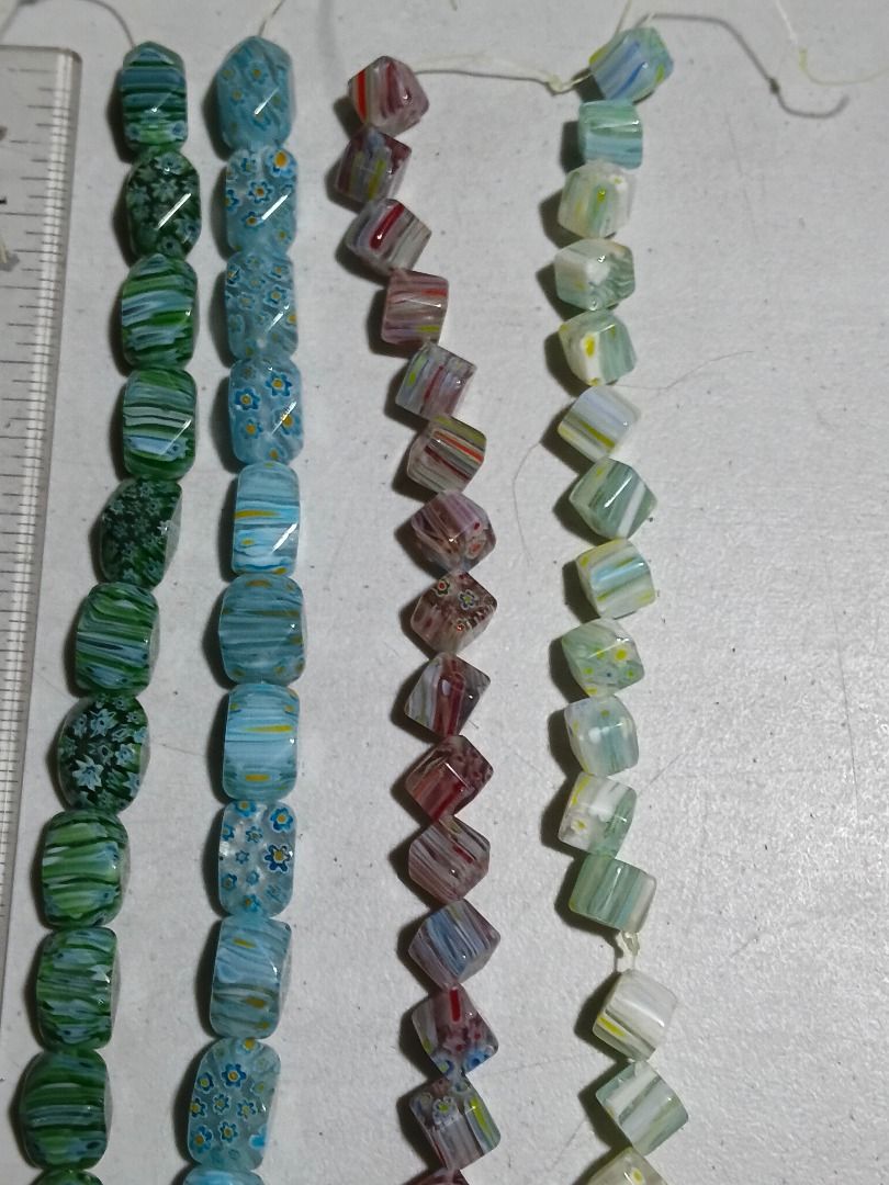 Millefiori Glass Trade Bead Strands (Java/Venetian Style) - 4 strands (Category: Craft Supplies & Tools) located in Marikina City. Submitted by my-an (Listing ID 1466578299, Image 1). Description: - 4 vibrant strands of vintage glass beads - Colors: Green, light blue, purple, and pale green - Shapes: Faceted cube and faceted barrel - Details: Unique millefiori and colorful striped patterns - Condition: Strung on plastic thread - Ideal for: DIY je