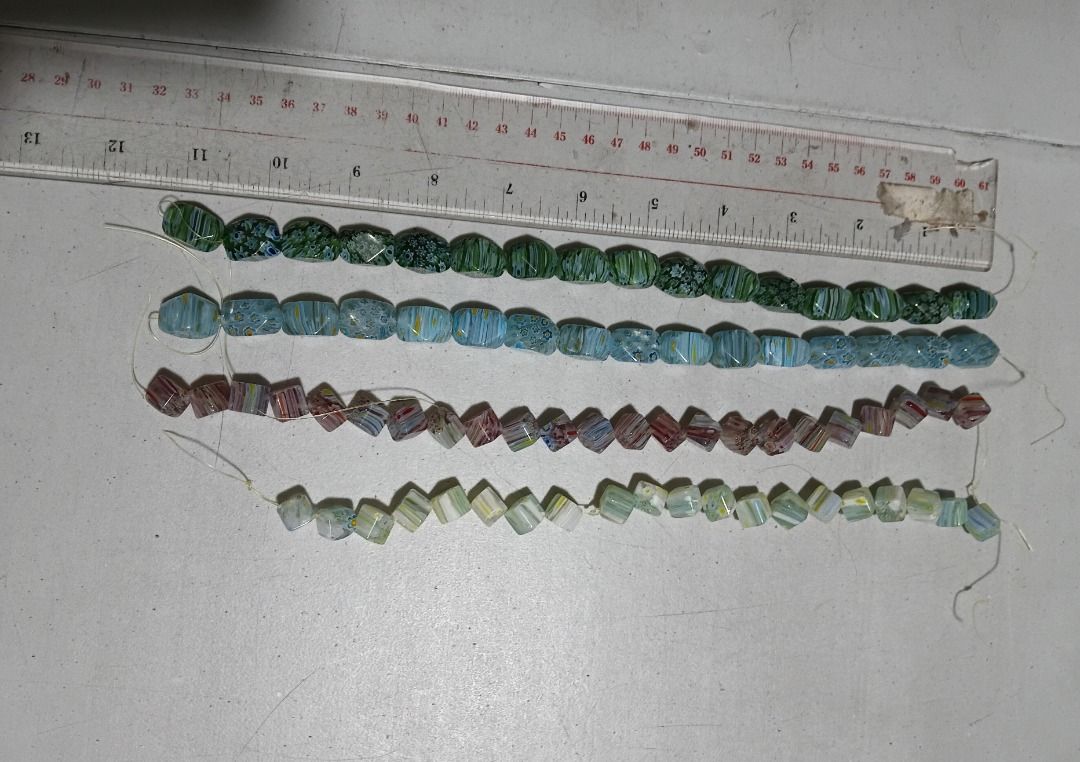 Millefiori Glass Trade Bead Strands (Java/Venetian Style) - 4 strands (Category: Craft Supplies & Tools) located in Marikina City. Submitted by my-an (Listing ID 1466578299, Image 2). Description: - 4 vibrant strands of vintage glass beads - Colors: Green, light blue, purple, and pale green - Shapes: Faceted cube and faceted barrel - Details: Unique millefiori and colorful striped patterns - Condition: Strung on plastic thread - Ideal for: DIY je