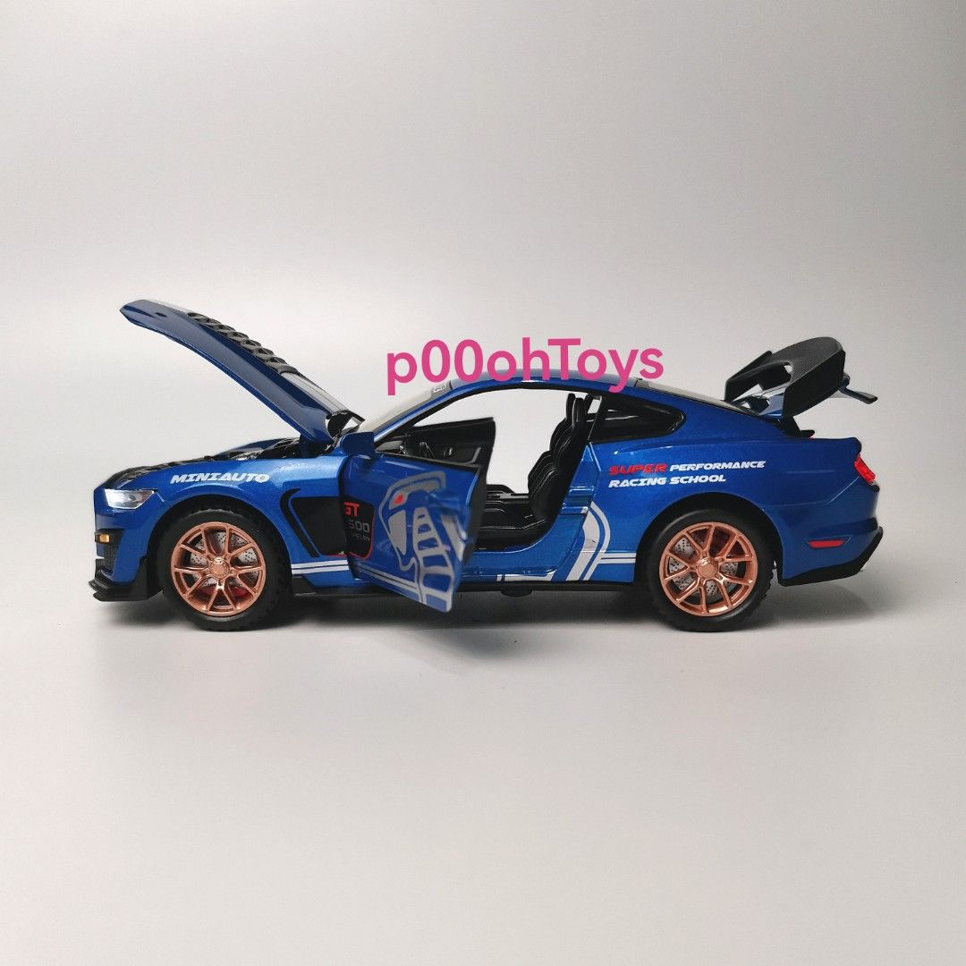 Mini Auto 1:32 Shelby Diecast Car (Category: Vehicle & Diecast Models) located in Tanza. Submitted by alloytoys (Listing ID 1466563890, Image 1). Description: - Scale: 1:32 Mini Auto Shelby GT500 Super Snake diecast model - Interactive Features: Opening hood, doors, and rear trunk with detailed interior - Lighting: Working LED headlights and taillights - Wheels & Tires: Copper-coloured alloy wheels fitted with rubber tires - Design: Custom racing