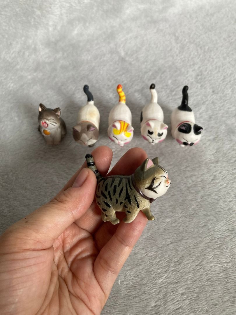 Mini Cat Figures (Category: Figurines & Statues) located in Rizal. Submitted by sheeraay (Listing ID 1466648761, Image 3). Description: -Twistable Head - Variety of poses and coat patterns (tabby, calico, tuxedo, solid) - Detailed facial expressions and painted collars - Cute painted paw prints on the bottom of the tabby - Perfect decor for shelves, desks, or cat lovers - Selling as a complete set.