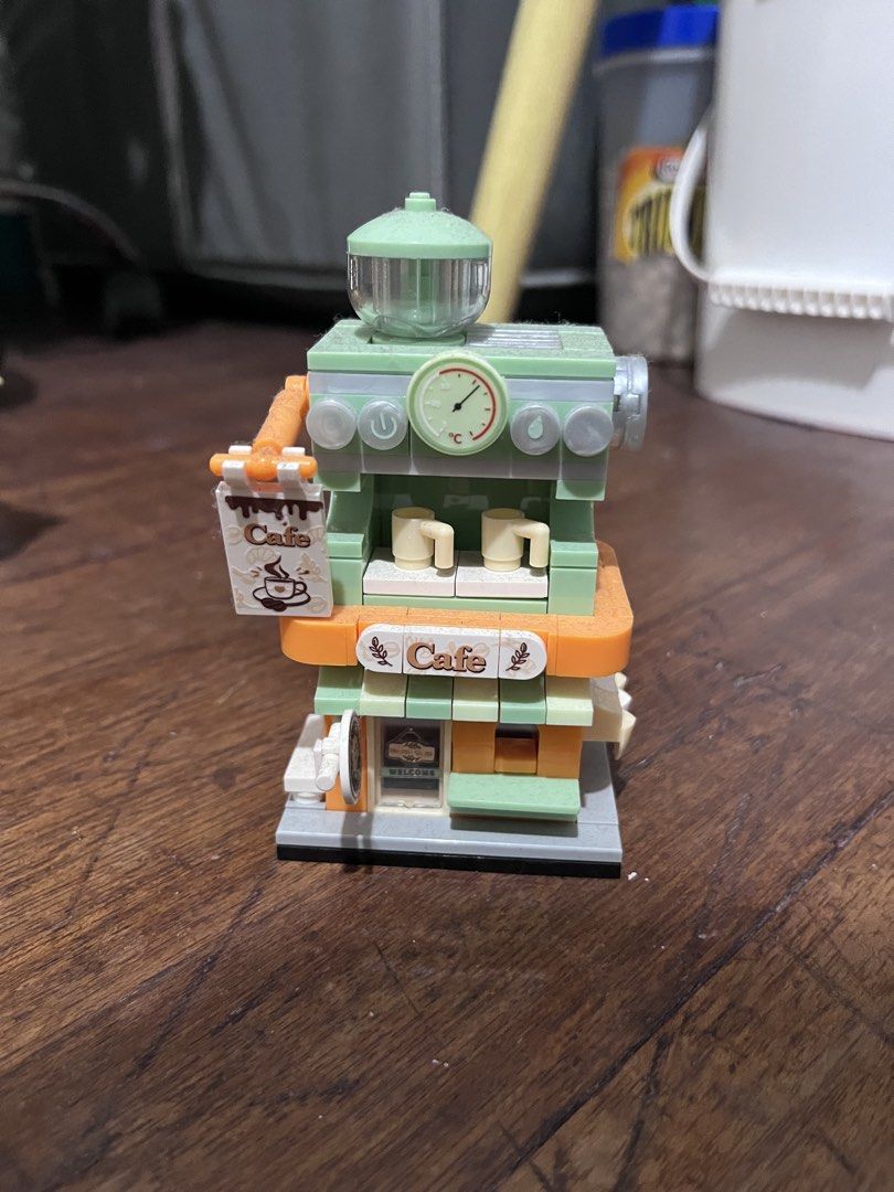Mini Micro Building Blocks Street View Shops Collection (Category: Lego & Building Sets) located in Manila. Submitted by oddstorm_9d6c74 (Listing ID 1466693601, Image 2). Description: - Pre-assembled mini building block set - features cute shops, cafes, and animal figures - Includes detailed storefronts like a dessert shop, bar, coffee station, and bunny toy store - Fully assembled and complete as shown in pictures - Fun and charming display piec