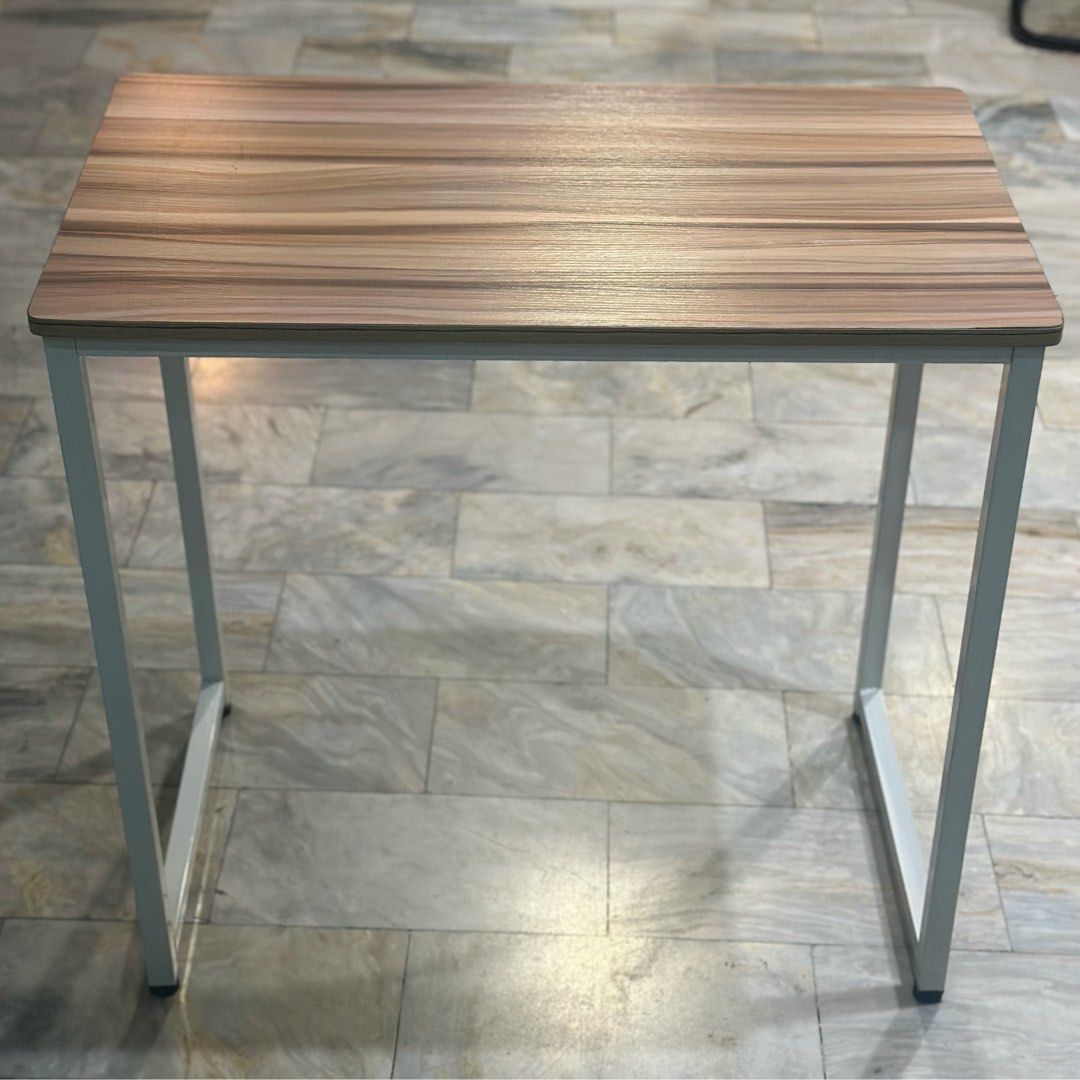 Minimalist study desk with wooden top and white frame (Category: Tables & Sets) located in Marikina City. Submitted by lovegoeson (Listing ID 1466569089, Image 3). Description: - Stylish wood grain top with clean white metal legs - Compact design, perfect for small rooms and tight corners - Sturdy steel frame ensures a wobble-free workspace - Smooth surface that is easy to wipe clean.