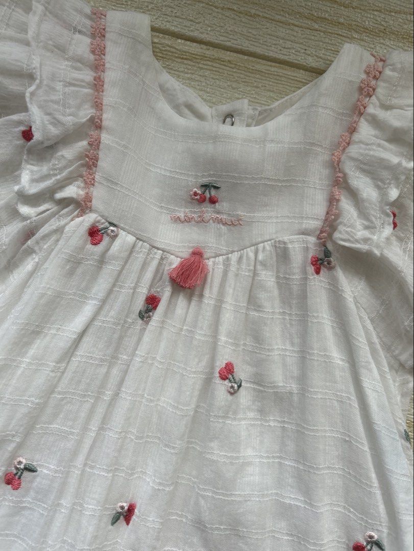 Minkmui Summer dress (Category: Babies & Kids Fashion) located in Cebu City. Submitted by yjainani (Listing ID 1466670554, Image 2). Description: white toddler girl's summer dress featuring small embroidered red cherries and flutter sleeves.